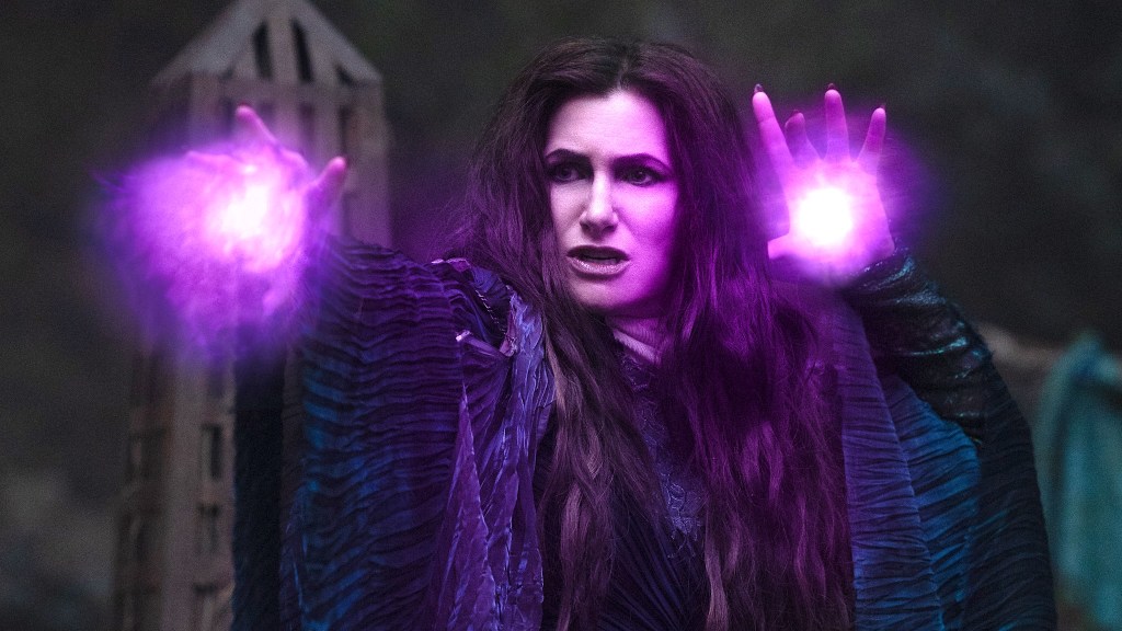 Kathryn Hahn as Agatha Harkness holding purple magic in Agatha All Along.