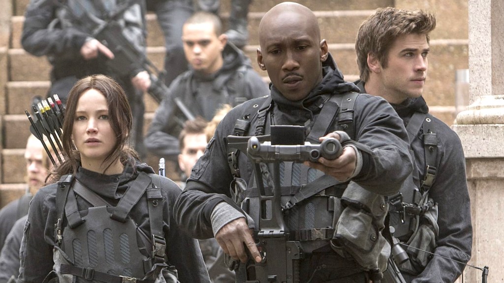 Jennifer Lawrence as Katniss, Mahershala Ali as Boggs, and Liam Hemsworth as Gale in The Hunger Games: Mockingjay Part 2